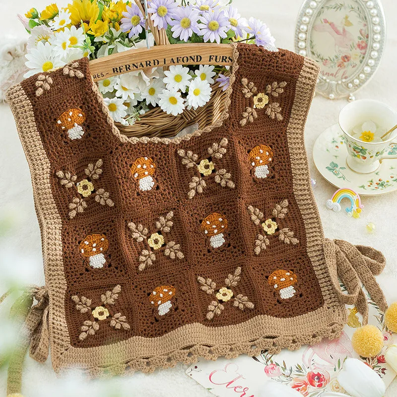 Crochet patchwork vest featuring woodland mushroom motifs
